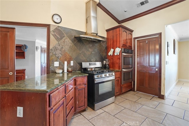 kitchen featuring wall chimney exhaust hood, backsplash, stainless steel appliances, dark stone countertops, and crown molding