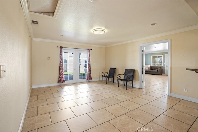 sitting room featuring ornamental molding, a wealth of natural light, and french doors