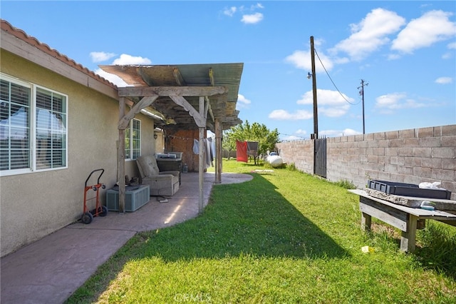 view of yard with a patio and central AC