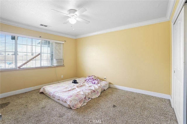 bedroom with ceiling fan, a closet, and carpet flooring