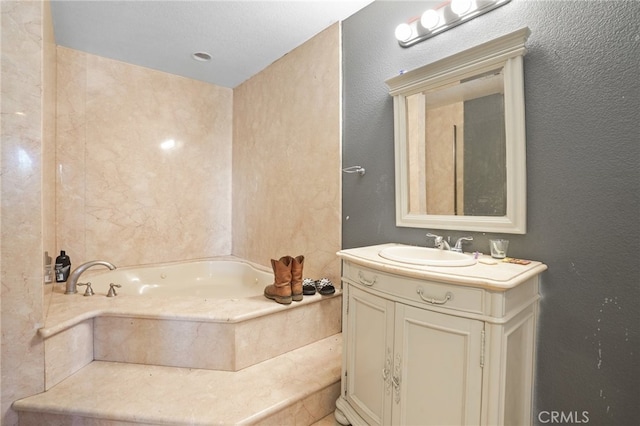 bathroom featuring a bath and vanity