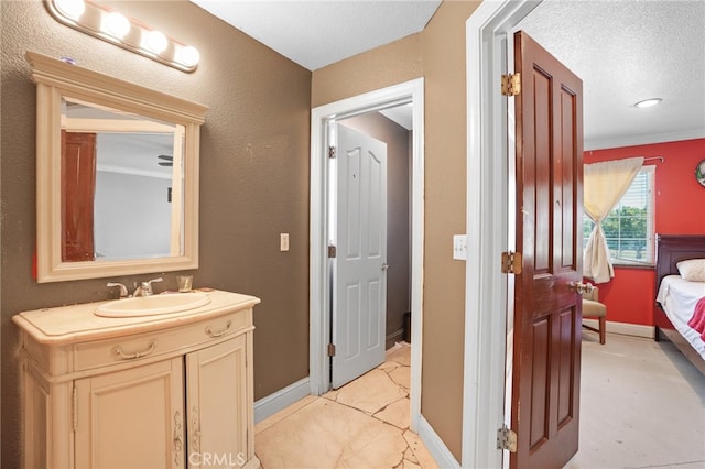 bathroom with vanity and a textured ceiling