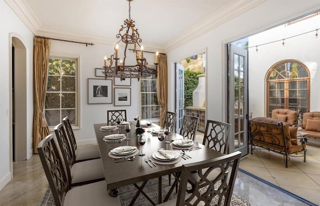 dining room featuring crown molding, light tile patterned flooring, and a notable chandelier