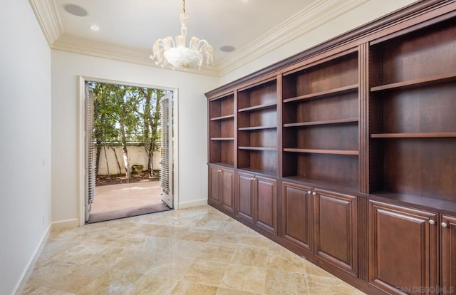 interior space with a notable chandelier and crown molding