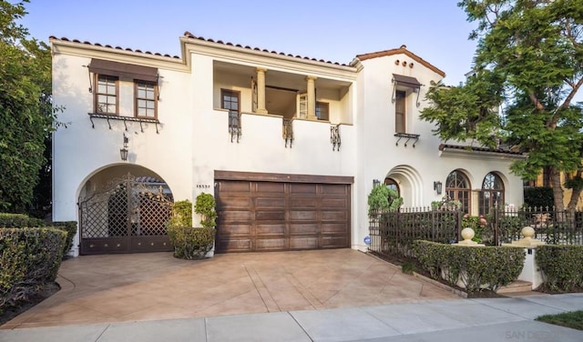 mediterranean / spanish house with a garage