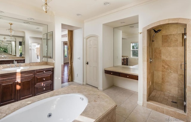 bathroom with crown molding, tile patterned flooring, vanity, and separate shower and tub