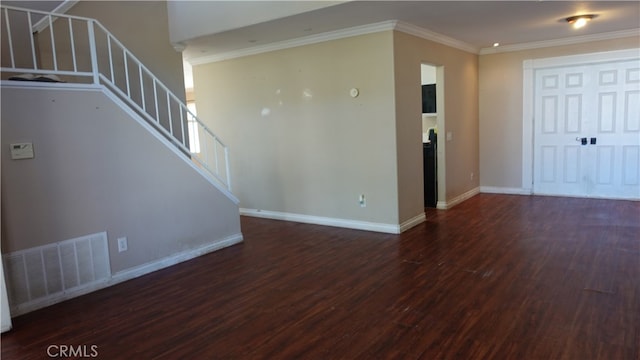 unfurnished living room featuring ornamental molding and dark wood-type flooring