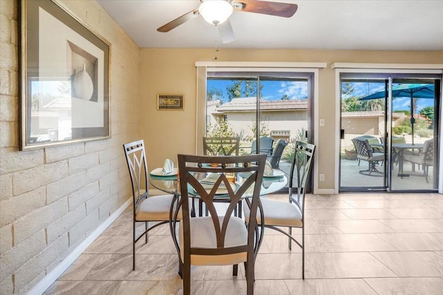 dining area with ceiling fan and a healthy amount of sunlight