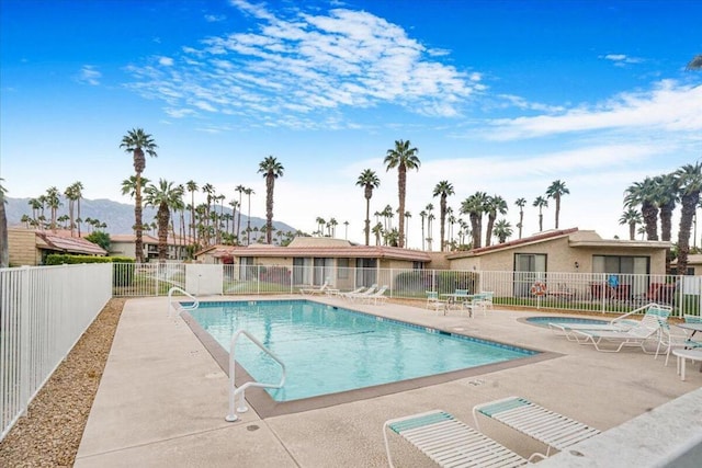 view of pool featuring a patio area and a mountain view