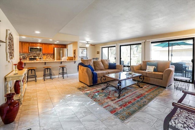 living room featuring ceiling fan