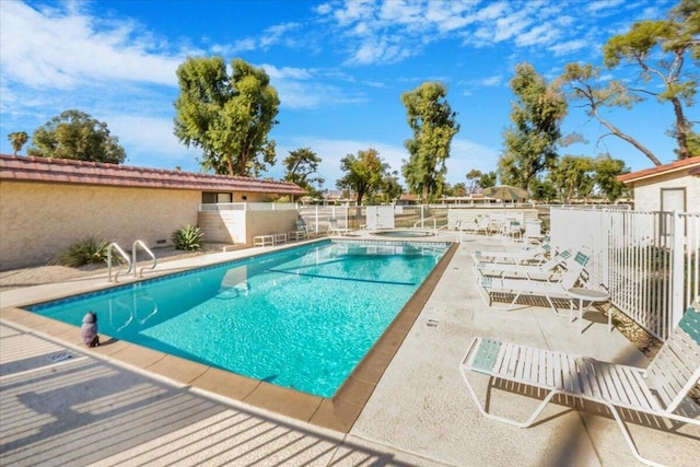 view of swimming pool with a patio