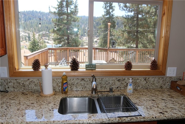 interior details with light stone counters and sink