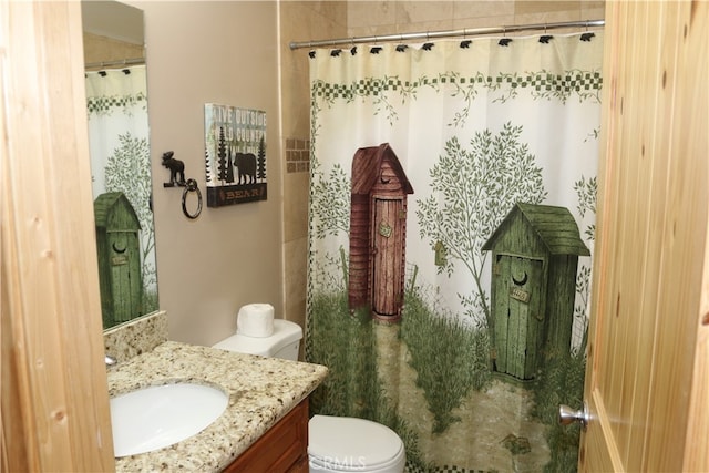 bathroom with vanity, toilet, and a shower with shower curtain