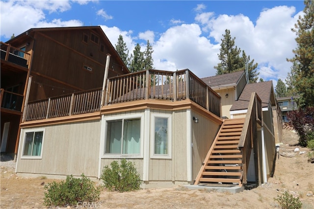 back of house with a wooden deck