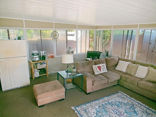 sunroom featuring lofted ceiling