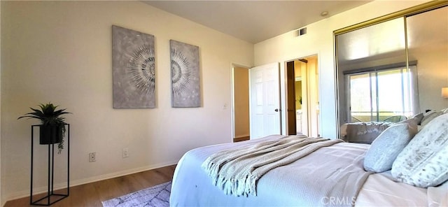 bedroom featuring a closet and hardwood / wood-style floors