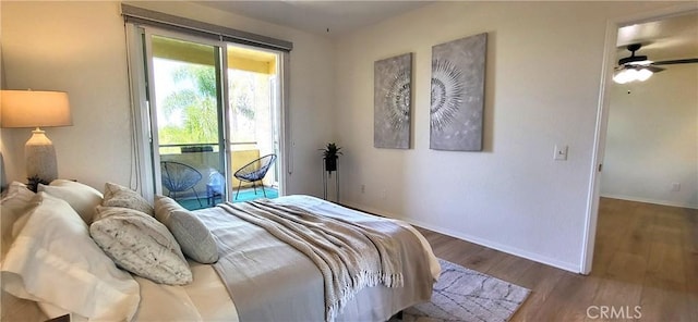 bedroom featuring access to exterior, wood-type flooring, and ceiling fan