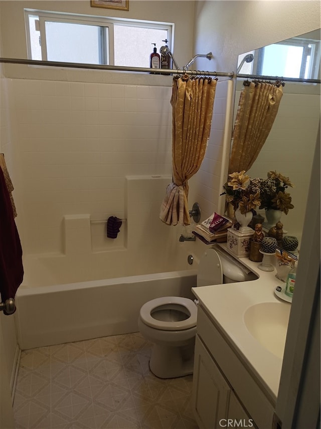 full bathroom with vanity, toilet, and shower / bath combo with shower curtain