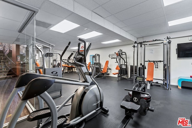 workout area with a drop ceiling