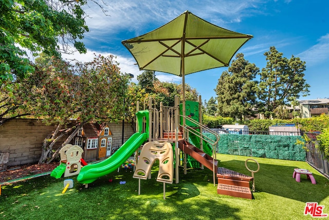 view of playground featuring a yard