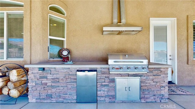 view of patio / terrace with area for grilling and a grill