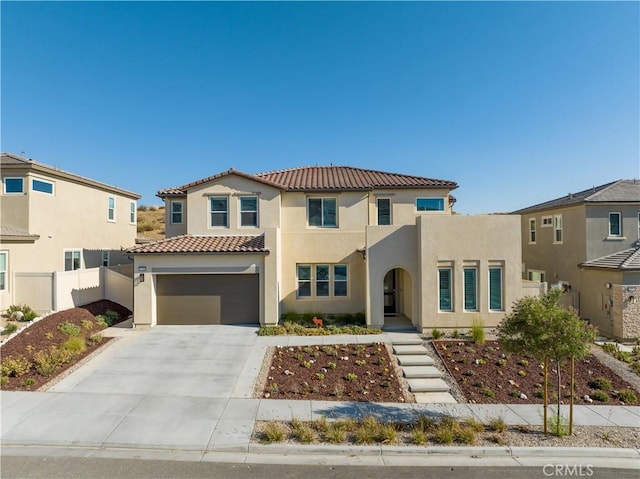 mediterranean / spanish-style home featuring a garage