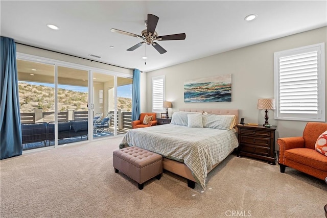 carpeted bedroom featuring ceiling fan and access to exterior