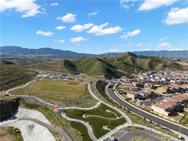 birds eye view of property with a mountain view