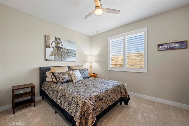 bedroom featuring ceiling fan and carpet