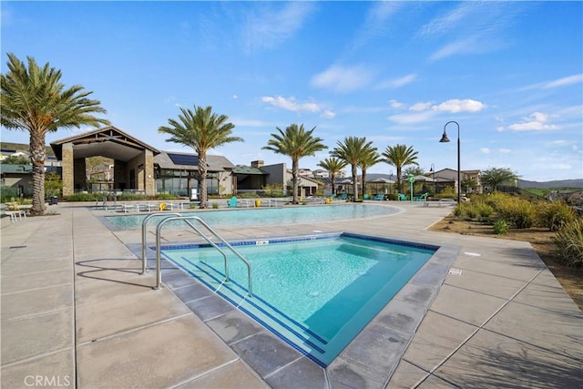 view of swimming pool featuring a patio area