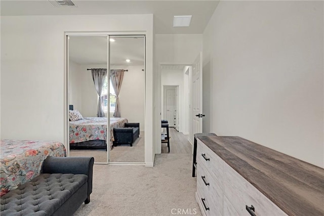 carpeted bedroom with a closet