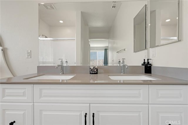 bathroom with vanity and walk in shower