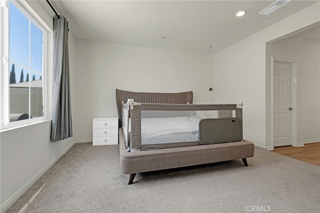 bedroom with light hardwood / wood-style flooring