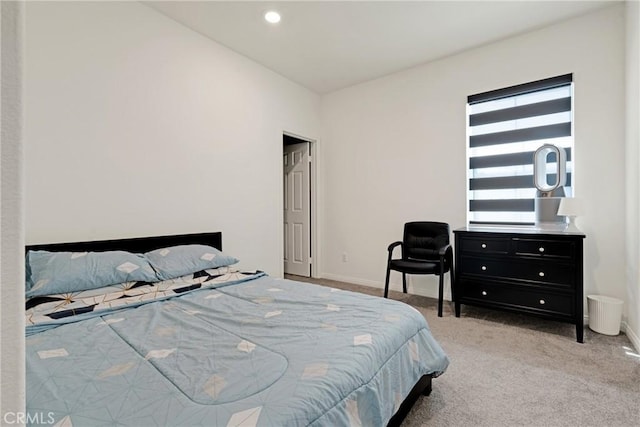 bedroom featuring light colored carpet