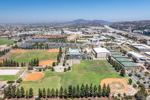 birds eye view of property with a mountain view