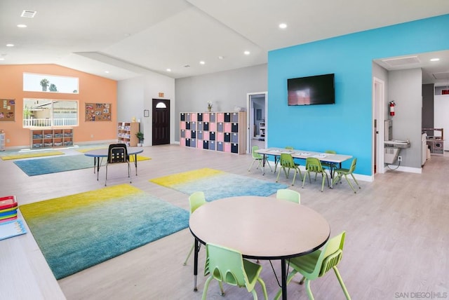 game room featuring light hardwood / wood-style flooring and lofted ceiling