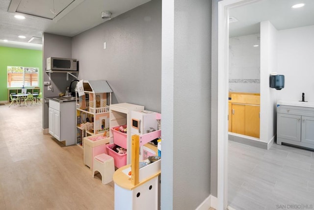 game room featuring light hardwood / wood-style floors