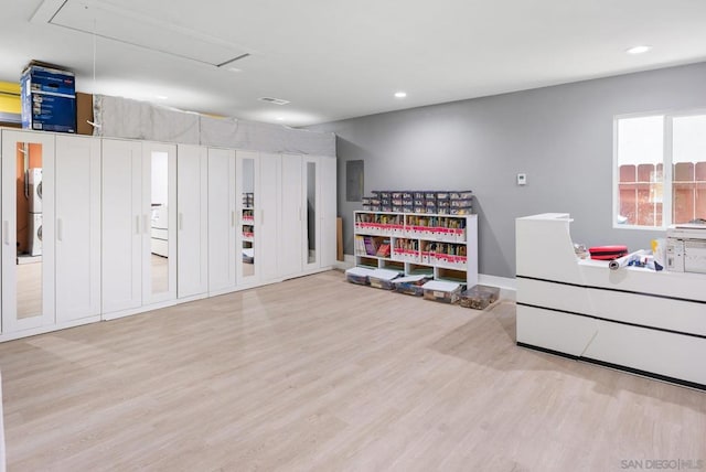 interior space with light wood-type flooring and electric panel