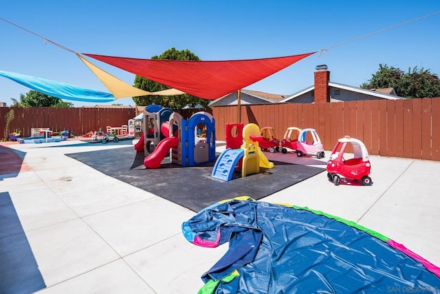 view of play area with a patio area