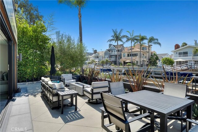view of patio / terrace featuring a residential view, an outdoor hangout area, and outdoor dining space