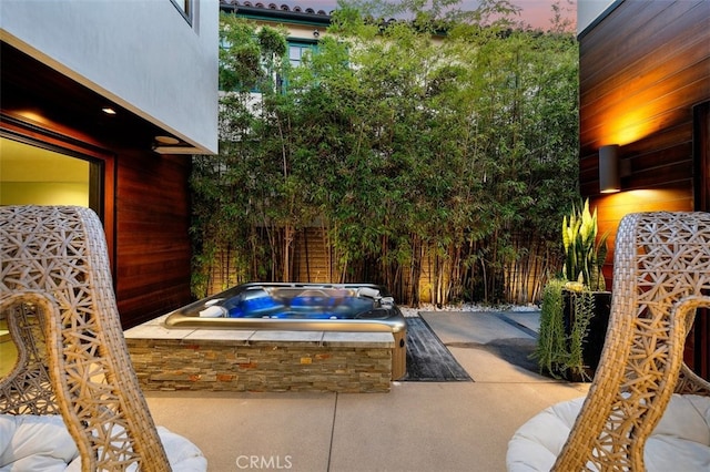 view of pool featuring a patio area and an outdoor hot tub