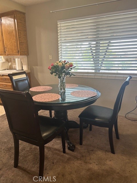 dining room featuring carpet flooring