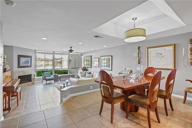 dining space with light tile patterned floors, ceiling fan, and a healthy amount of sunlight