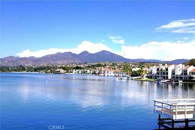 view of water feature featuring a mountain view and a boat dock