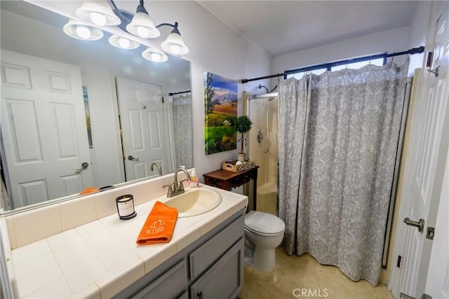 bathroom with curtained shower, vanity, and toilet