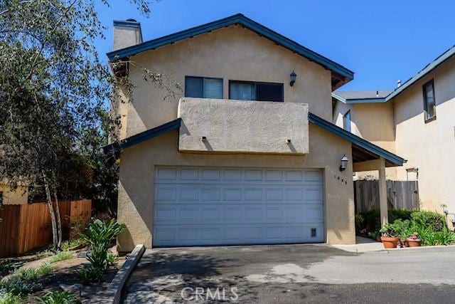 view of front of house with a balcony and a garage