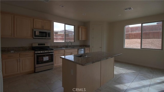 56925 Hidden Gold Ct, Yucca Valley, CA 92284 - kitchen with appliances with stainless steel finishes, light tile patterned floors, and healthy amount of natural light