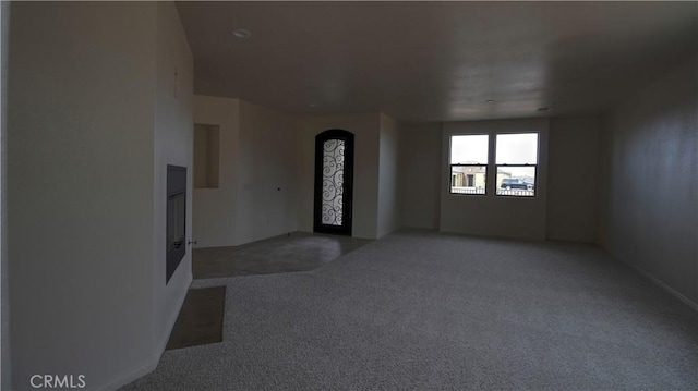 56925 Hidden Gold Ct, Yucca Valley, CA 92284 - empty room with light carpet and arched walkways