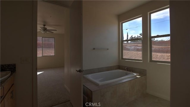 56925 Hidden Gold Ct, Yucca Valley, CA 92284 - bathroom featuring plenty of natural light, vanity, a bath, and a ceiling fan