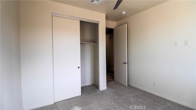 56925 Hidden Gold Ct, Yucca Valley, CA 92284 - unfurnished bedroom with carpet flooring, a closet, and a ceiling fan